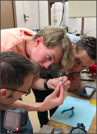 NASA Scientist & iLEAD Students Looking at Rusted Iron from ISS